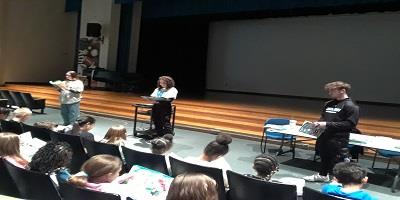 Seniors reading to Elementary Students